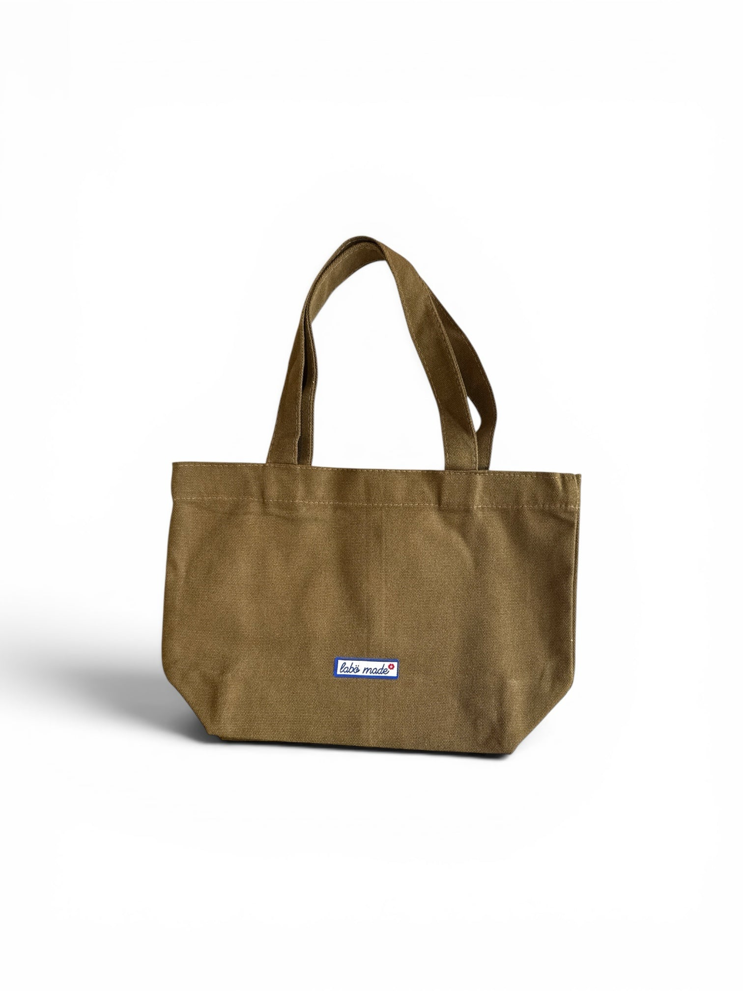 Labö Made olive green mini canvas tote bag with reinforced handles and a small branded label on a white background.